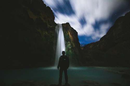 havasu falls man standing in front of body of water standing
